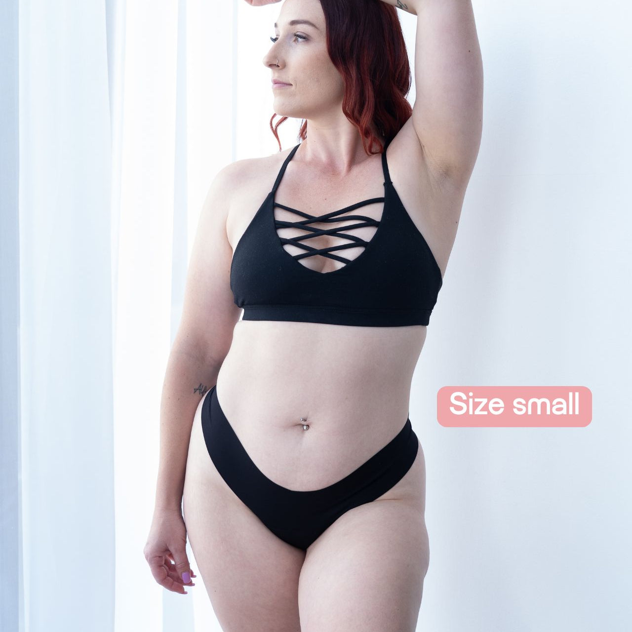 Model wearing black seamless Fredgies thong