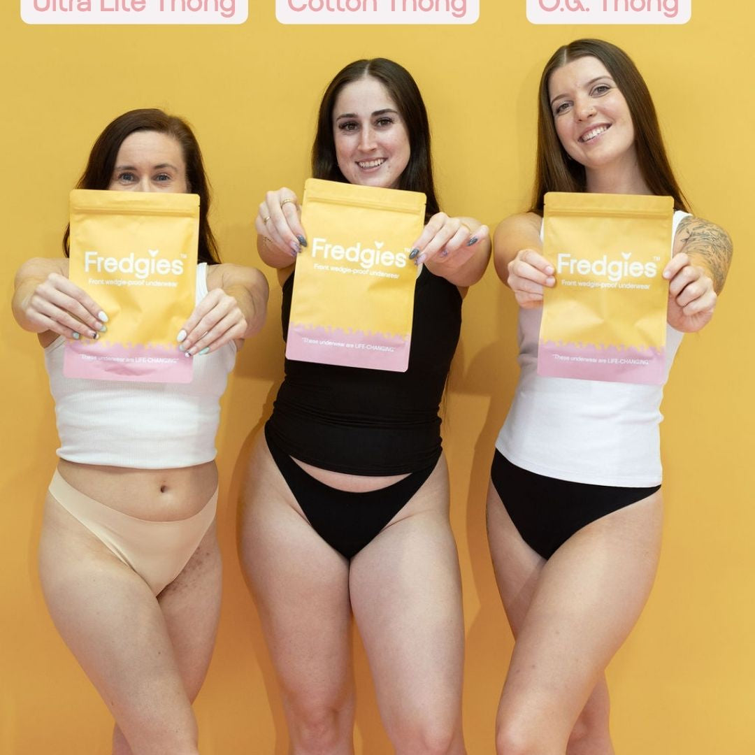 Three women holding yellow packages labeled 'Ultra Lite Thong', 'Cotton Thong', and 'O.G. Thong' against a yellow background.