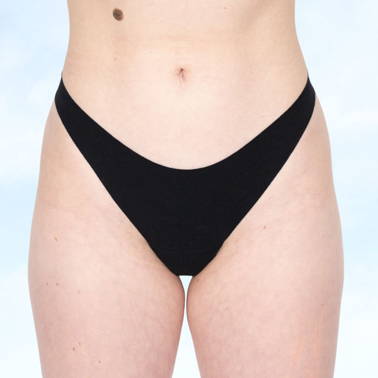 Black Fredgies underwear bottom worn by a person on a light blue background