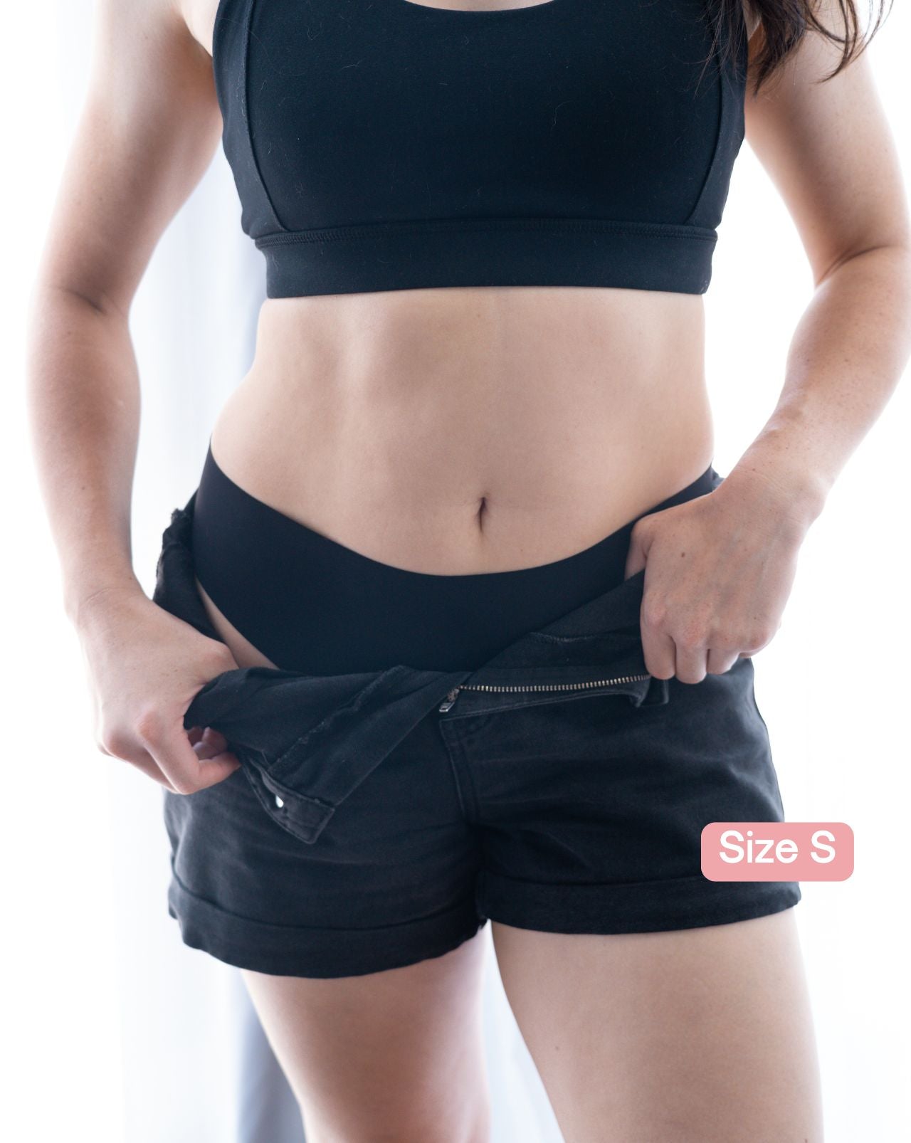 Woman revealing black Fredgies under shorts