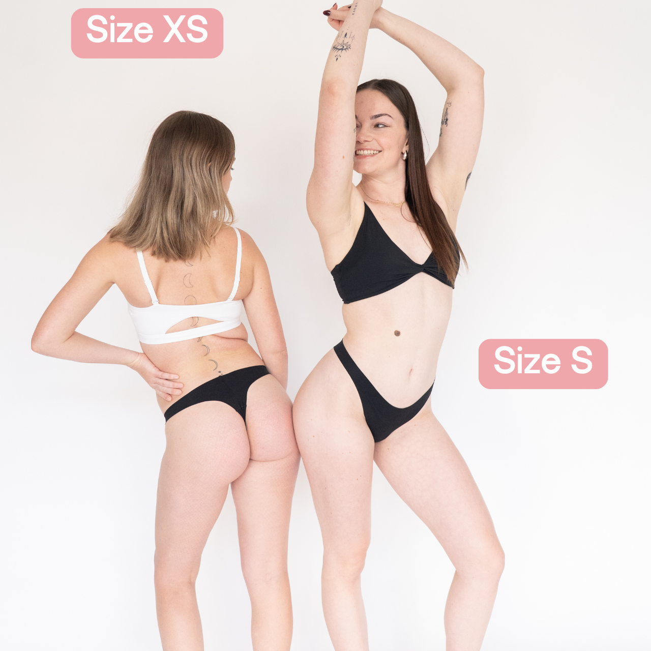 Two models wearing black Lite Fredgies