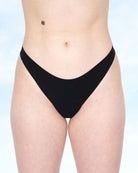 Black Fredgies underwear bottom worn by a person on a light blue background