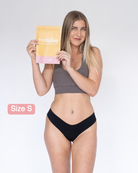 Model holding Fredgies packaging